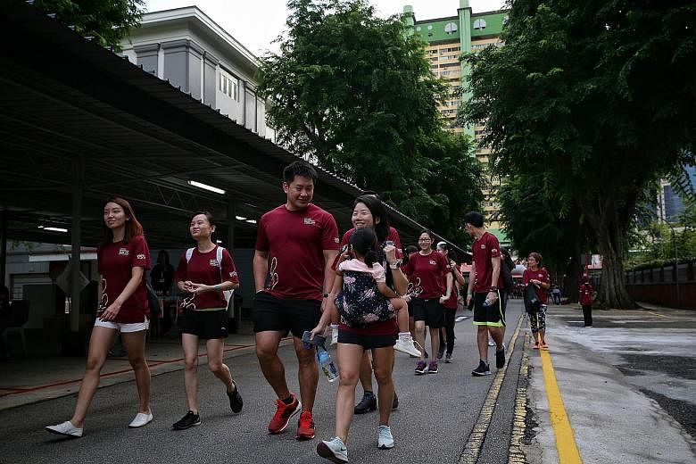 Participants along Eu Tong Sen Road during Tan Tock Seng Hospital's charity heritage walk yesterday. The 8km route, which goes past significant places in Tan Tock Seng's life, was organised to mark the hospital's 175th anniversary. ST PHOTO: KEVIN LI