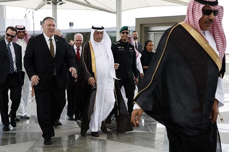 US Secretary of State Mike Pompeo being accompanied by Saudi Foreign Minister Ibrahim Abdulaziz Al-Assaf upon his arrival in Jeddah yesterday. Mr Pompeo was scheduled to hold talks with Saudi Arabia and the United Arab Emirates on the tensions with I