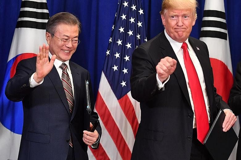 United States President Donald Trump and South Korean President Moon Jae-in at a bilateral meeting in New York last September, where they signed a trade agreement. Mr Trump is set to meet Mr Moon in Seoul on Sunday, when they will discuss "ways to wo