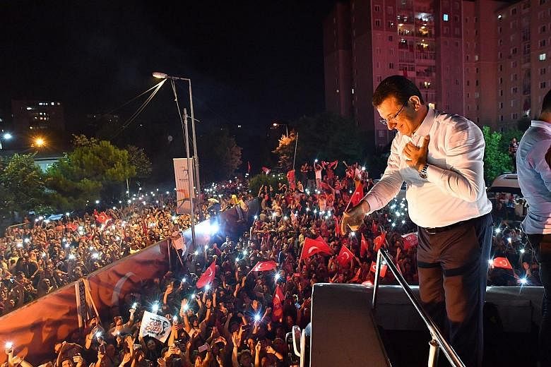 Newly re-elected Istanbul Mayor Ekrem Imamoglu greeting his supporters after his victory on Sunday. The opposition politician gained a decisive 54 per cent of the votes in his victory over the ruling AKP candidate Binali Yildirim's 45 per cent. The l
