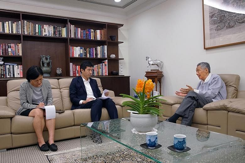 Prime Minister Lee Hsien Loong speaking with Mr Takashi Nakano, Singapore bureau chief of the Nikkei Asian Review. PM Lee said Japan has a very large elderly population, and Singapore will reach that point in a decade. PHOTO: MCI
