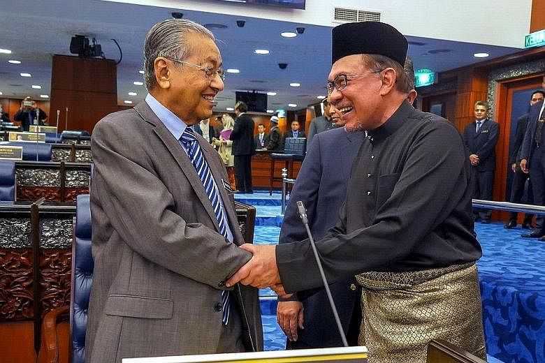 Malaysian Prime Minister Mahathir Mohamad and his designated successor and former protege Anwar Ibrahim in a photo taken last year.