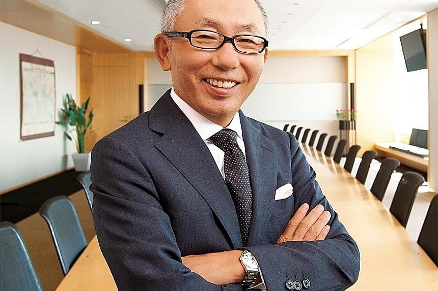 Fast Retailing CEO Tadashi Yanai (above) is considering offering higher pay to draw talented people. The company owns Uniqlo stores such as this outlet (left) in Orchard Road. ST FILE PHOTO