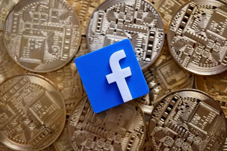 A 3D-printed Facebook logo on representations of the Bitcoin virtual currency. Facebook announced last week it planned to launch Libra next year, which is backed by a host of companies including Visa and PayPal.