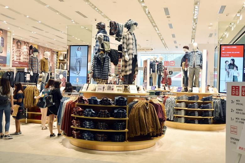 Fast Retailing CEO Tadashi Yanai (above) is considering offering higher pay to draw talented people. The company owns Uniqlo stores such as this outlet (left) in Orchard Road. ST FILE PHOTO