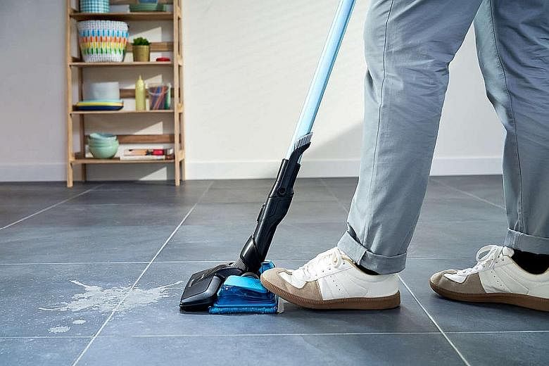 The SpeedPro Max Aqua has a vacuum-and-mop nozzle that sucks up dust, then mops the just-vacuumed area in the same action. There is a pedal to control water release while mopping.