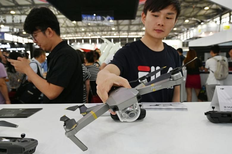 A DJI drone on display at the Consumer Electronics Show, Ces Asia 2019, in Shanghai earlier this month. DJI, a privately-held Chinese firm says it is repurposing a warehouse in California to assemble a new version of a drone popular among US governme