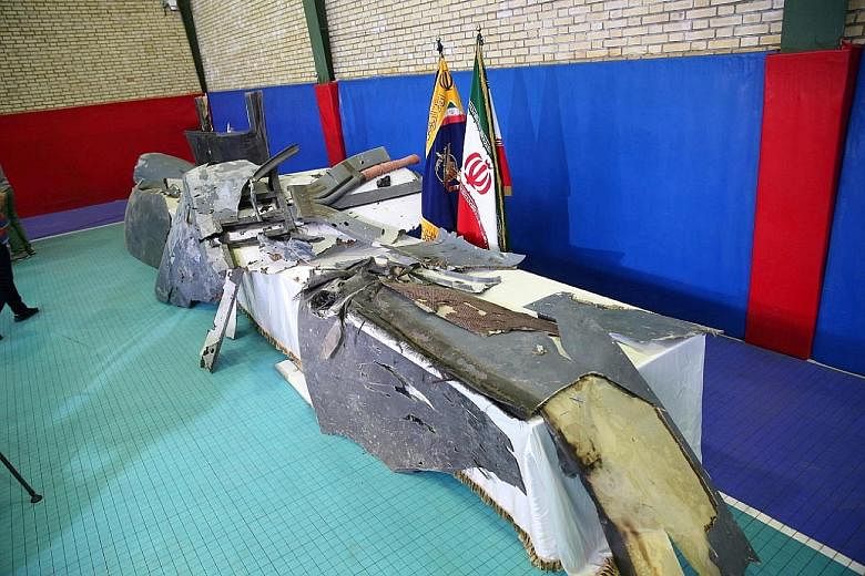 The purported wreckage of the American drone on display by the Islamic Revolutionary Guard Corps in Teheran last Friday. Iran said it was found 6.4km within its territorial waters.