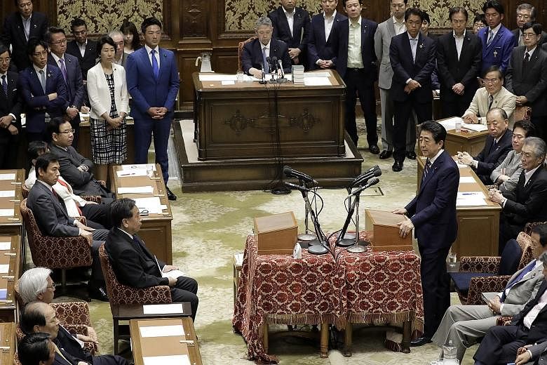 Japanese Prime Minister Shinzo Abe speaking during a party leaders' debate last week at the Lower House of Parliament in Tokyo. Mr Abe's Liberal Democratic Party is expected to keep its majority in the coming election, though possibly with reduced nu