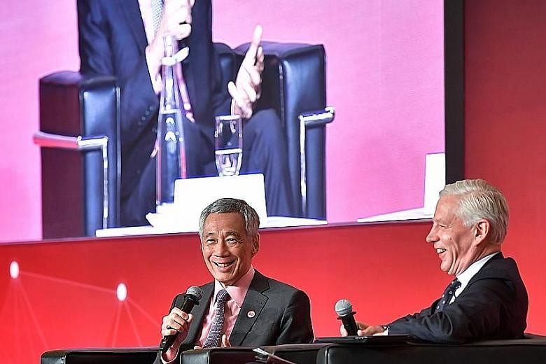 Prime Minister Lee Hsien Loong participating in a dialogue at yesterday's Smart Nation Summit, with moderator Dominic Barton, global managing partner emeritus at McKinsey & Co. In his speech earlier in the day, PM Lee said that while Singapore has a 