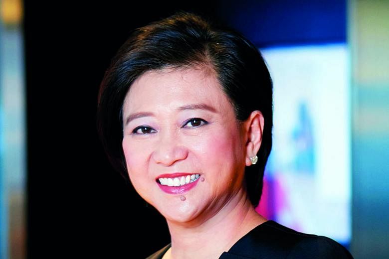 Singtel's CEO Chua Sock Koong saw her salary package nearly halved in the last financial year. Meanwhile, the telco's cyber-security business chalked up widening losses before interest and tax of $102 million for the 12 months to March 31. PHOTO: REU