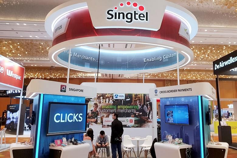 Singtel's CEO Chua Sock Koong saw her salary package nearly halved in the last financial year. Meanwhile, the telco's cyber-security business chalked up widening losses before interest and tax of $102 million for the 12 months to March 31. PHOTO: REU