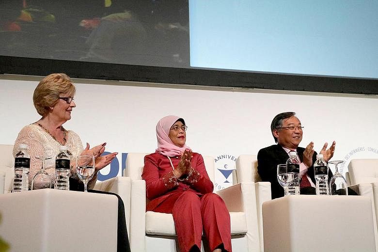 President Halimah Yacob, flanked by International Council of Nurses president Annette Kennedy and Health Minister Gan Kim Yong, at the opening ceremony of the ICN congress at Sands Expo and Convention Centre yesterday. Over 5,000 nurses and nursing p