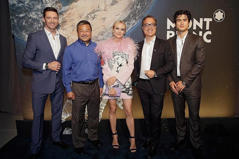 At the launch of Montblanc's re-imagined line of StarWalker pens are (from left) actor Hugh Jackman, former astronaut Leroy Chiao, actress Diane Kruger, Montblanc's chief executive officer Nicolas Baretzki and actor Charles Melton.