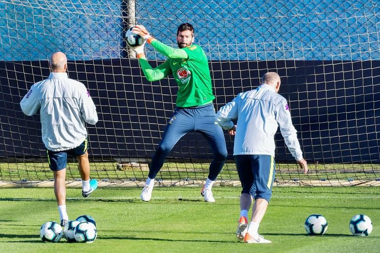 Brazil goalkeeper Alisson practising penalty saves during a training session in Porto Alegre on Wednesday. The Brazilians are keen to avoid a third loss on penalties to Paraguay when they meet in the quarter-finals of the Copa America. PHOTO: AGENCE 
