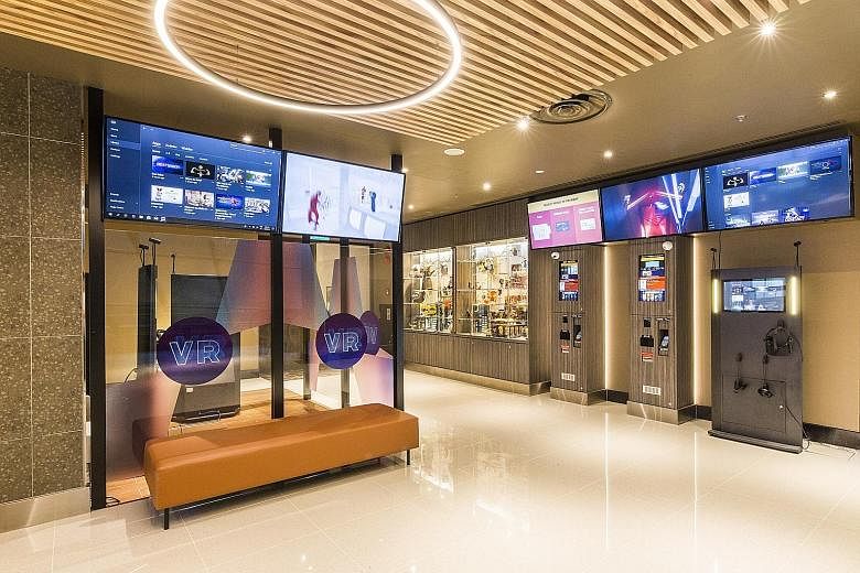 Virtual reality pods in the foyer of GV Funan allow patrons to enjoy immersive VR gaming and cinematic content.