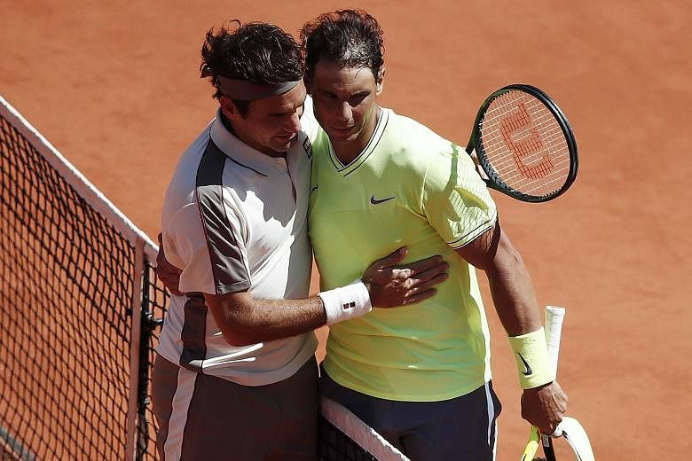 Swiss legend Roger Federer congratulating Spanish clay king Rafael Nadal after he lost their French Open semi-final on June 7. The pair are tipped to meet in the final four in a fortnight at Wimbledon.