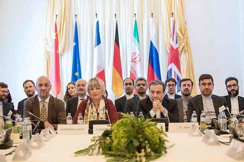Diplomats at yesterday's meeting on the Iran nuclear deal in Vienna included Mr Abbas Araghchi (second from right), Iran's Deputy Foreign Minister, and Ms Helga Schmid, secretary-general of the EU's External Action Service. PHOTO: AGENCE FRANCE-PRESS