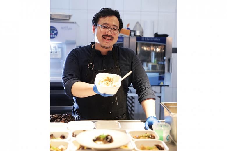Mr Woo Wai Leong, chef-owner of Restaurant Ibid, with tasting portions of his dishes.