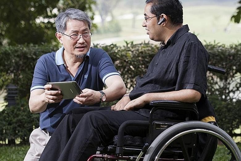 Founder Thomas Ng (far left) of Genashtim, a cloud-based digital solutions provider which hires people with disabilities, and employee Raj Kumar Selvaraj, a process manager.