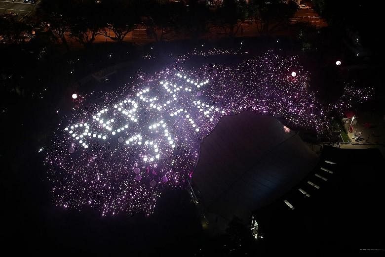 The Pink Dot SG event at Hong Lim Park yesterday ended with attendees holding up pink and white lights to form a display calling for the repeal of Section 377A. This was in response to Prime Minister Lee Hsien Loong's comment that Section 377A would 