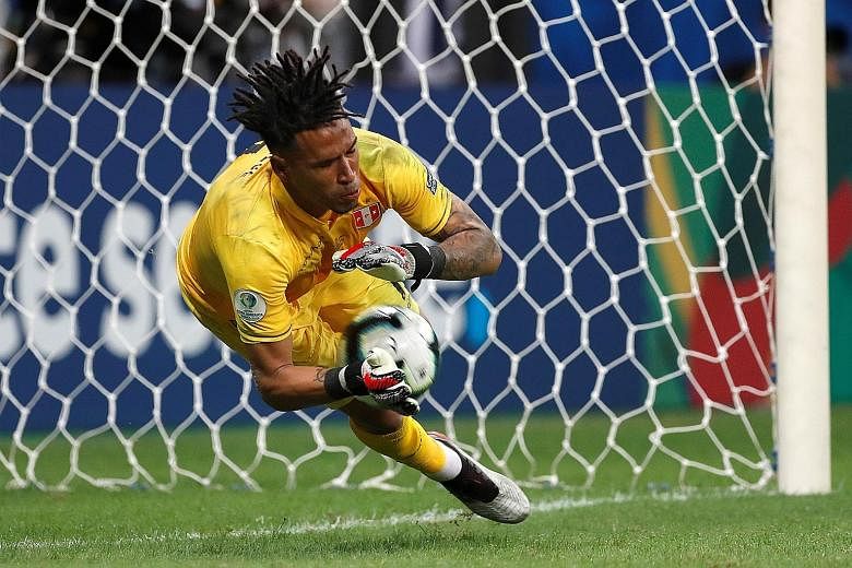 Left: Peru goalkeeper Pedro Gallese saving Uruguay's first penalty when Luis Suarez shoots straight into him at Arena Fonte Nova Stadium in Salvador, Brazil, on Saturday. Above: A distraught Suarez is comforted by Uruguay goalkeeper Fernando Muslera.