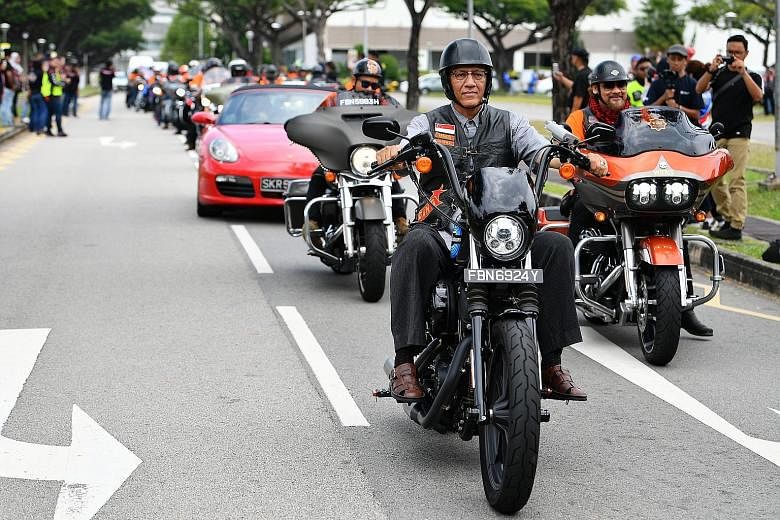 Mr Mohamed Abdullah Alhabshee, President Halimah Yacob's husband, cruising on a bike sponsored by Harley-Davidson of Singapore, at the outdoor carpark near Kallang Leisure Park yesterday. More than 700 motorcyclists - some from Malaysia and Brunei - 