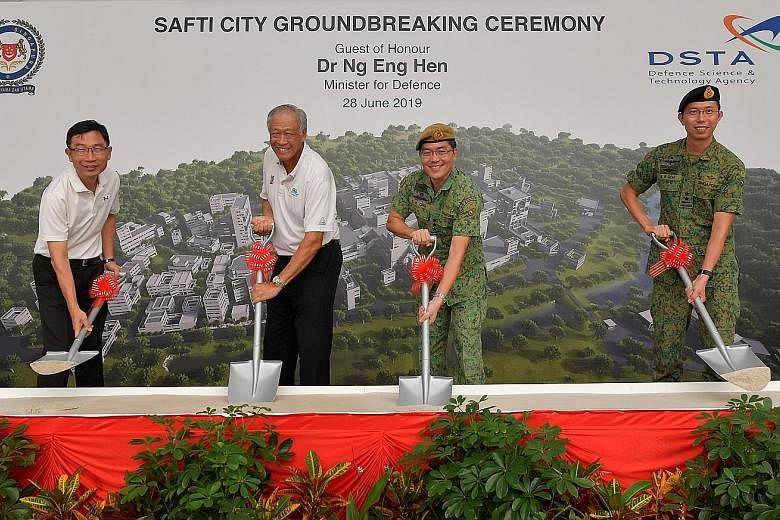 Defence Minister Ng Eng Hen with (from left) Defence Science and Technology Agency chief executive Tan Peng Yam; Chief of Defence Force, Lieutenant-General Melvyn Ong; and Chief of Army, Major-General Goh Si Hou, doing the symbolic sod-turning for th