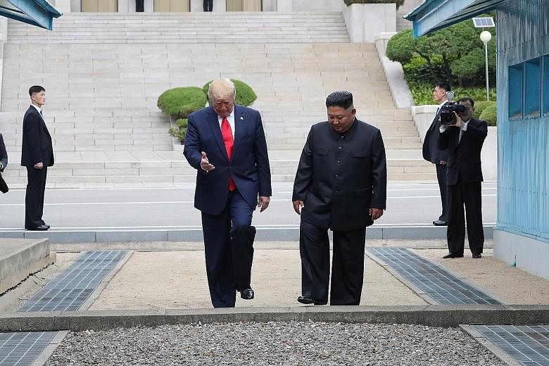 United States President Donald Trump stepping into the North Korean side of the Military Demarcation Line (left), then stepping back into the South with North Korean leader Kim Jong Un yesterday. PHOTOS: AGENCE FRANCE-PRESSE, DPA