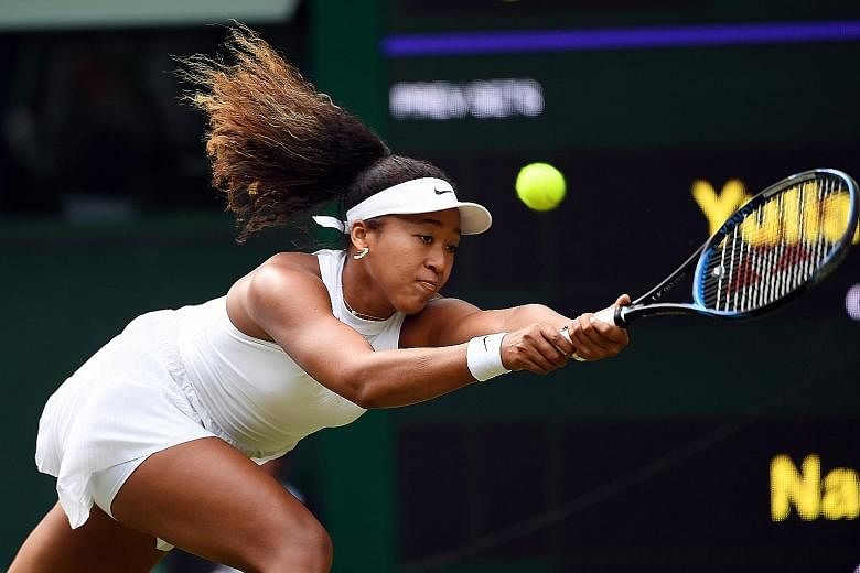 Japan's world No. 2 Naomi Osaka was stunned 7-6 (7-4), 6-2 by Yulia Putintseva in the first round of Wimbledon yesterday. It was her second loss to the Kazakh in a month. PHOTO: EPA-EFE