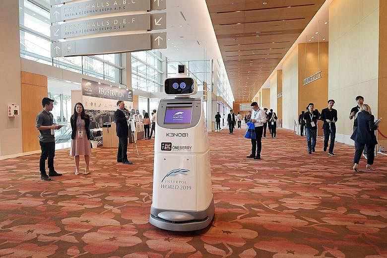 Robot security guard KenOBI deployed by OneBerry Technologies at the Interpol World conference at Marina Bay Sands yesterday.