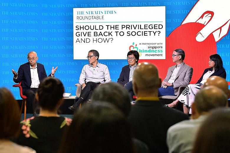 Yesterday's panel discussion on the topic of privilege in Singapore and giving back to society was moderated by (from left) Straits Times editor-at-large Han Fook Kwang, and involved Lien Foundation chairman Laurence Lien; Singapore Management Univer