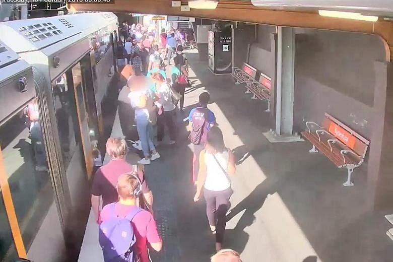 A video grab showing a boy as he falls through the gap between a train and the station platform in February in Sydney, Australia. PHOTO: REUTERS