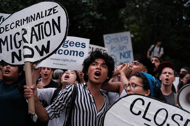 Hundreds of people protesting against migrant detention facilities in front of US Senator Chuck Schumer's Brooklyn apartment.PHOTO: AGENCE FRANCE-PRESSE