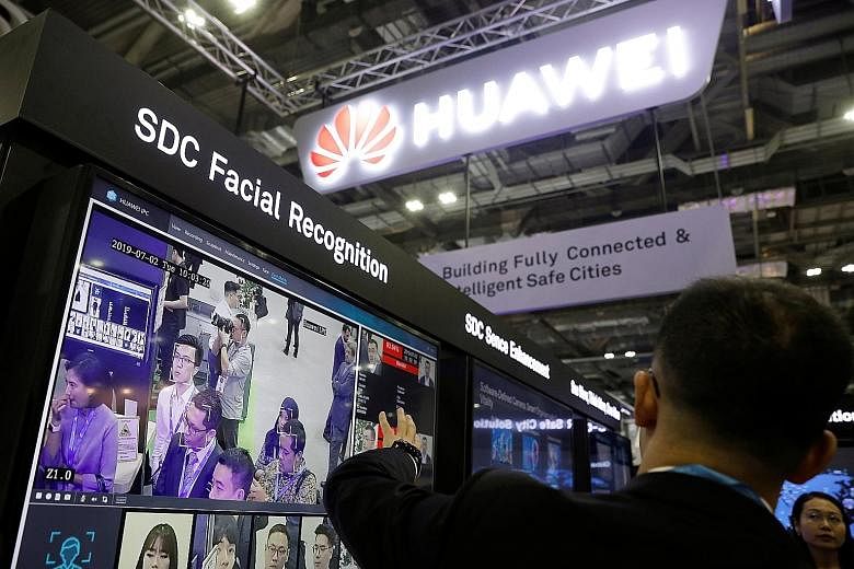 Huawei's booth at a fair in Singapore earlier this week. US President Donald Trump has sowed confusion with a vow to ease a ban on sales to the firm.