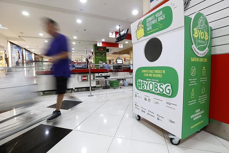A donation bin for reusable bags at FairPrice Xtra in Kallang Wave Mall. Bins for the public to donate unused reusable bags have been placed at eight supermarket outlets - two each from FairPrice, Cold Storage, Sheng Siong and Prime Supermarket - and