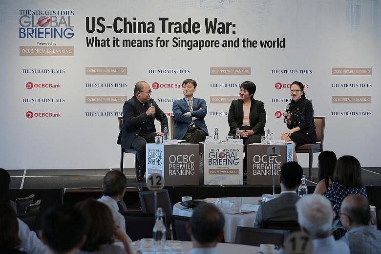(From far left) ST foreign editor Jeremy Au Yong, Associate Professor Li Mingjiang of the S. Rajaratnam School of International Studies, OCBC economist Selena Ling and ST tech editor Irene Tham discussing the impact of the US-China trade war on the w