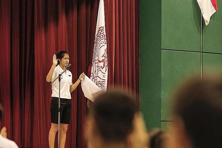 Tennis player Joelle Goh leading the Singapore contingent in reciting the oath during the Asean Schools Games send-off ceremony at Tanjong Katong Secondary School yesterday.