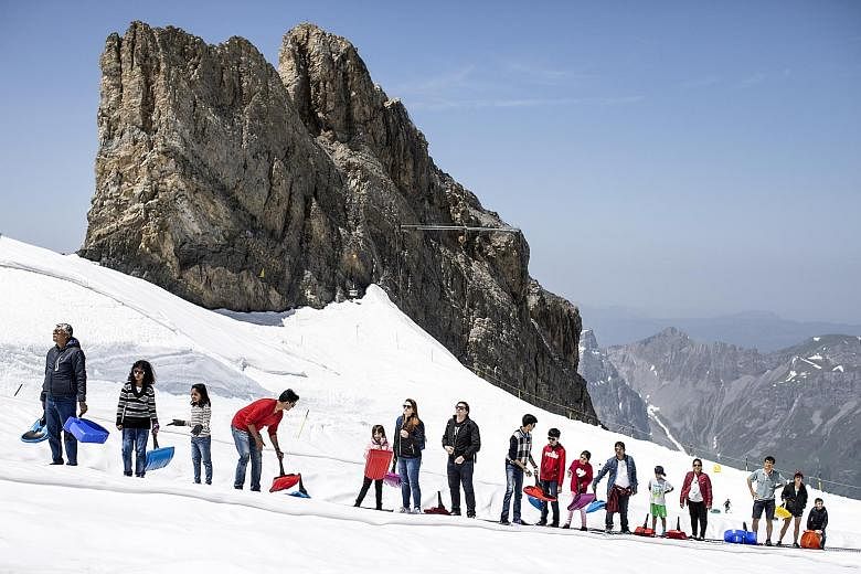 Expatriates like Switzerland for its high pay and quality of life. Many also see the nation of iconic ski resorts as a great place to raise children. PHOTO: EPA-EFE