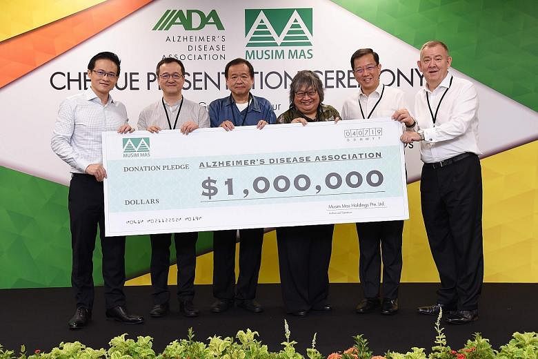 (From left) North East District Mayor Desmond Choo; Musim Mas director and chief financial officer Alvin Lim Ek Tie; Musim Mas director Lim Ek Kian; Alzheimer's Disease Association (ADA) vice-president Ng Li-Ling; ADA chief executive Jason Foo; and M