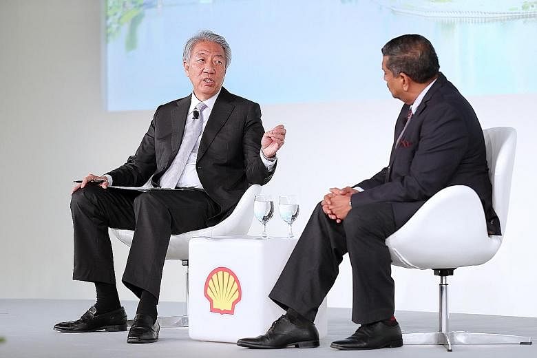 Above: Senior Minister Teo Chee Hean speaking at a dialogue moderated by Strategic Moves chief executive Viswa Sadasivan at the Shell Powering Progress Together Forum yesterday.
