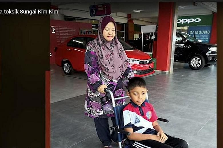 Twelve-year-old Irfan Wafiy Idham Wazir developed myokymia after sniffing poisonous gases from Sungai Kim Kim in Pasir Gudang. The Parkinson's-like condition causes parts of the body to tremble. PHOTO: METROTV