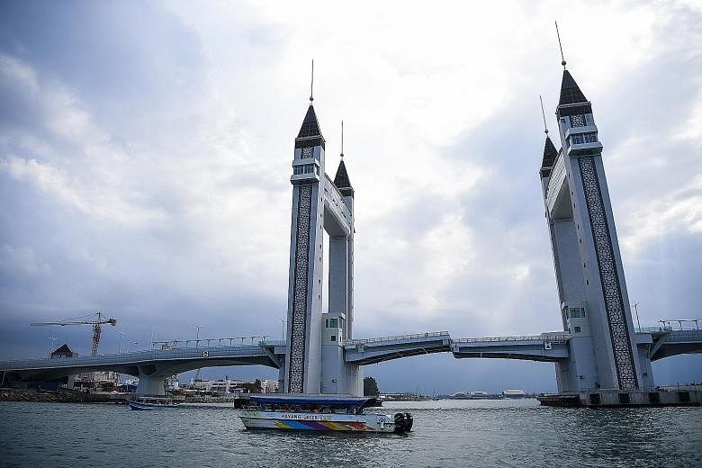 A RM250 million (S$83 million) drawbridge in Kuala Terengganu built using oil royalties given to the former Umno state government. Terengganu Menteri Besar Ahmad Samsuri Mokhtar (above) says the state government can look forward to some RM1 billion a