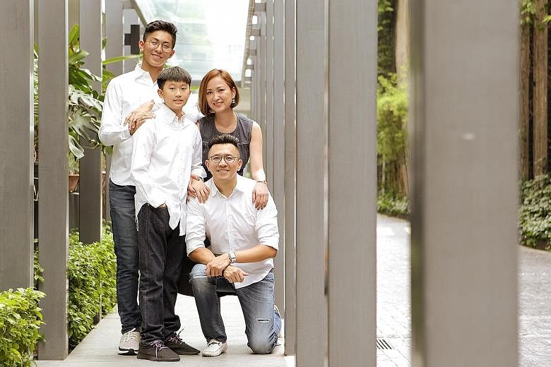 Finance executive Adam Tan with his wife Teresa Lim and their sons Isaac, 16, and Josiah, 13. Apart from investing in unit trusts, equities and property, he has invested in endowment plans and investment-linked plans for his sons' education.