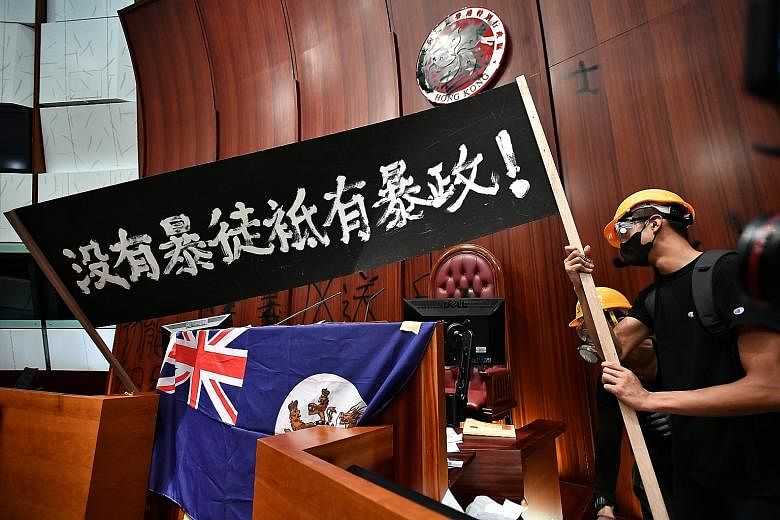 Protesters inside the Legislative Council on July 1. Their underlying frustration has accumulated over the years, over issues from wealth disparity to out-of-reach home prices, and a sense of eroding democratic norms.