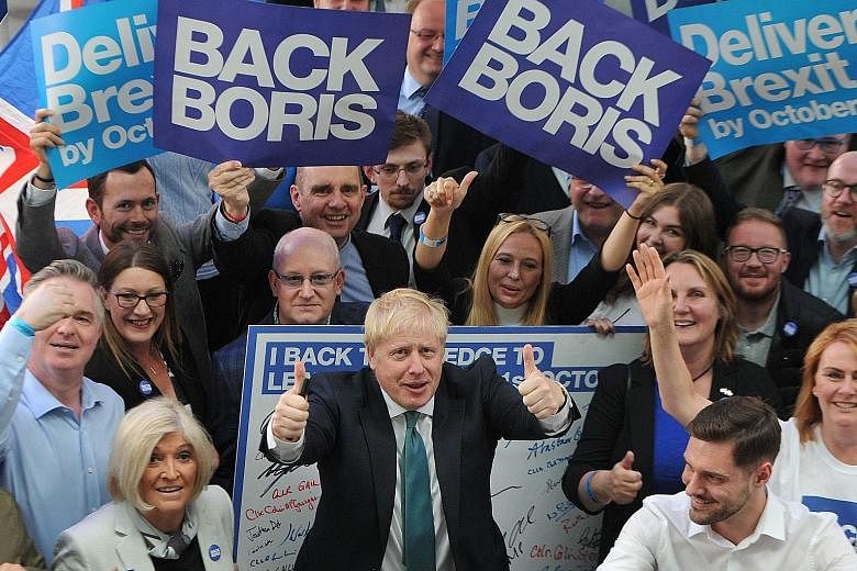 Mr Boris Johnson with supporters at a Conservative Party event in Perth, Scotland, on Friday.