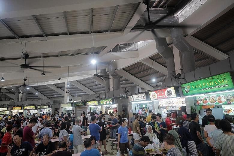 The newly reopened Tampines Round Market and Food Centre has wider walkways, energy-conserving lamps, better ventilation and high-volume, low-speed ceiling fans. ST PHOTOS: JASON QUAH