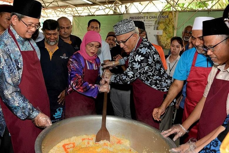 (From left) Mufti Fatris Bakaram, President Halimah Yacob, Mr Mohamed Abdullah Alhabshee, Masjid Khalid chairman Alla'udin Mohamed and Environment and Water Resources Minister Masagos Zulkifli at the President's Challenge Charity Briyani at Masjid Kh