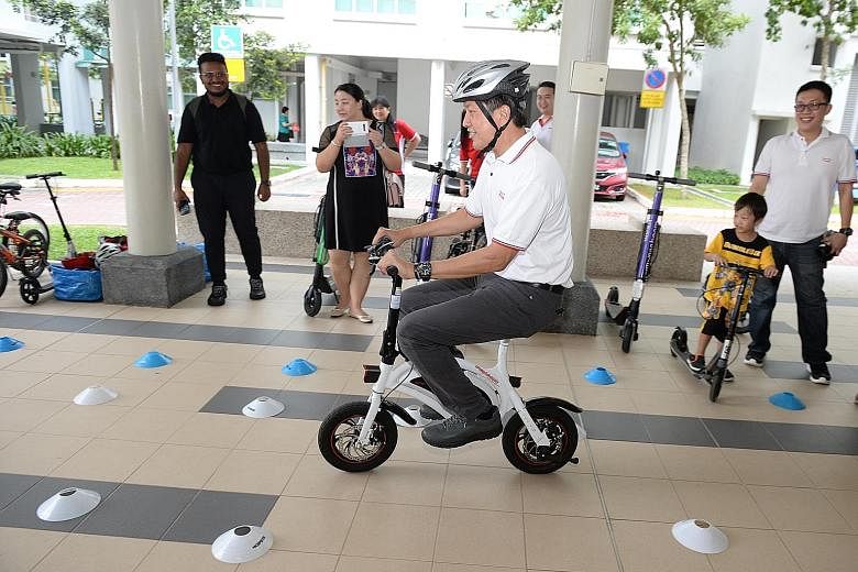 Minister in the Prime Minister's Office Ng Chee Meng taking part in a safe-riding activity at the Buangkok Fun Carnival yesterday. PHOTO: LIANHE ZAOBAO