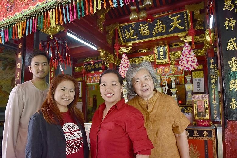 Singapore Heritage Society executive director Chua Ai Lin (second from left) with researchers (from left) Fauzy Ismail, Lynn Wong and Vivienne Wee at Seng Wong Beo, a temple in Tanjong Pagar.